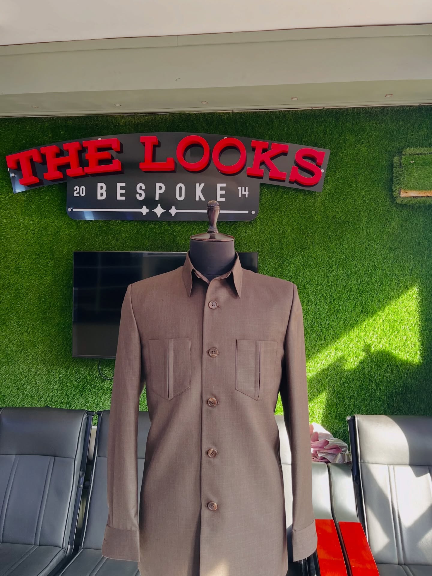 Bespoke suit on display at The Looks Bespoke showroom, Kampala (showroom look 31)