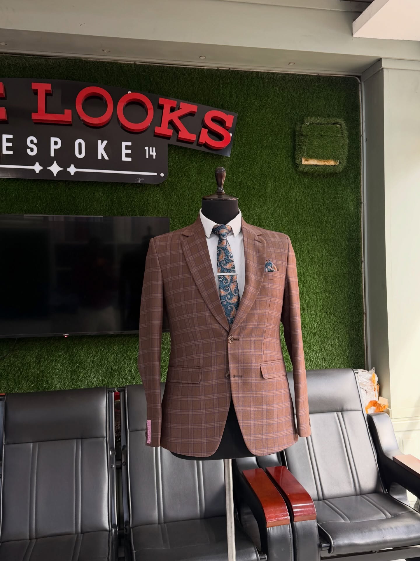 Bespoke suit on display at The Looks Bespoke showroom, Kampala (showroom look 46)