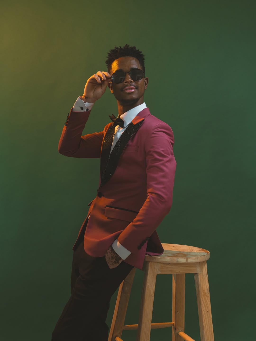 Custom-fitted tuxedo with hand-finished lapels (suits look 24)