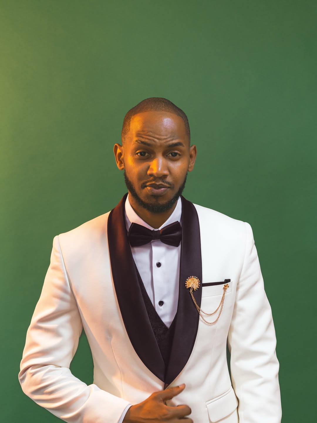 Custom-fitted tuxedo with hand-finished lapels (suits look 31)