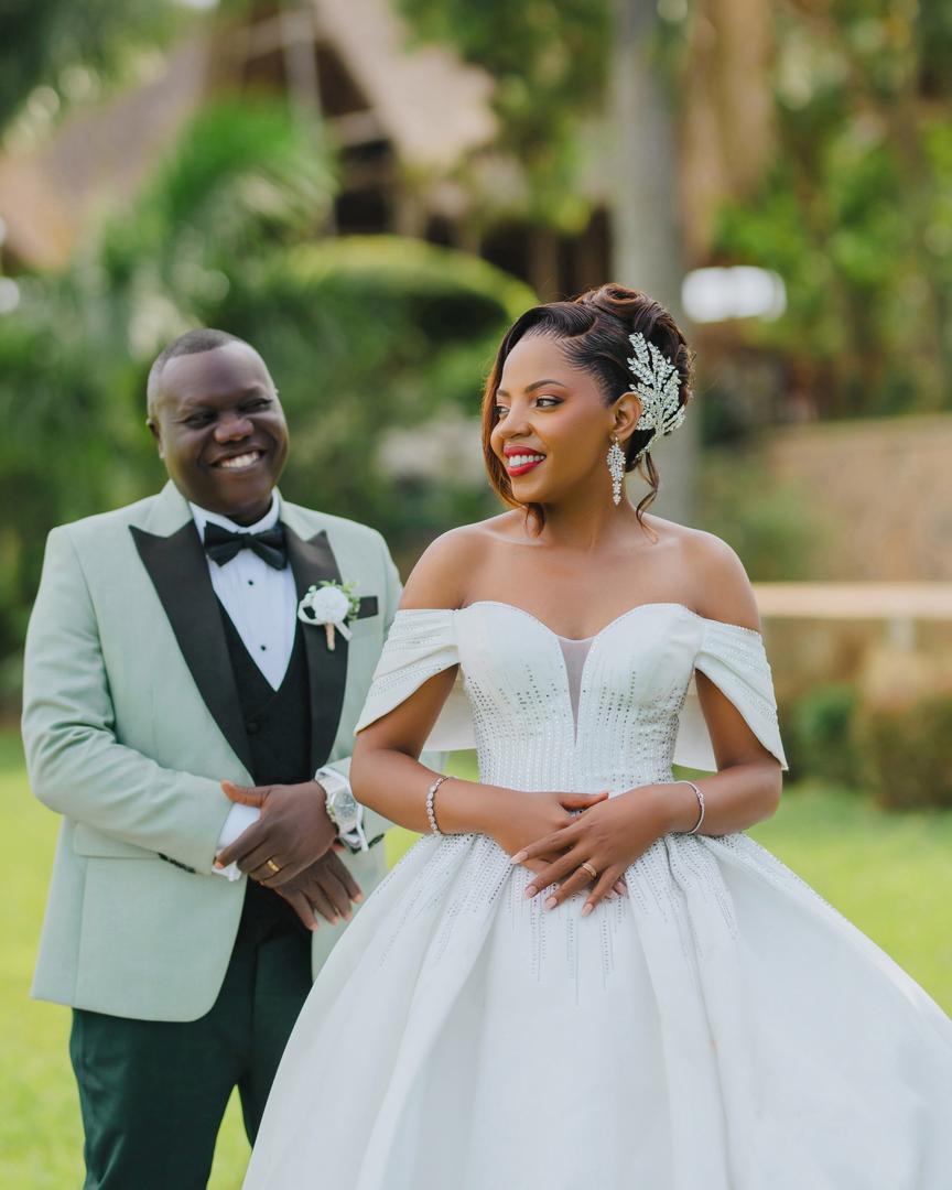 Wedding-day suit hand-finished in Nsambya (weddings look 150)